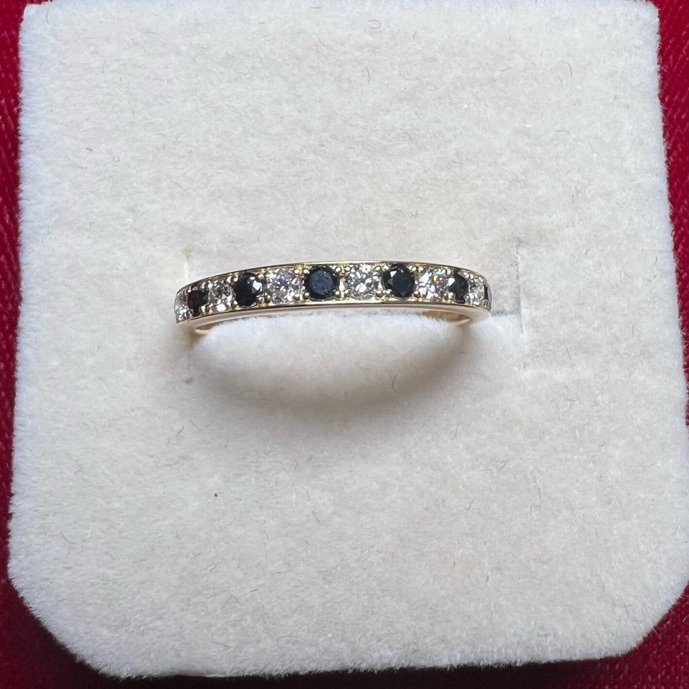 Black and white diamond half eternity ring